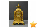 Pendule en bronze  dor� � colonnes d�tach�es